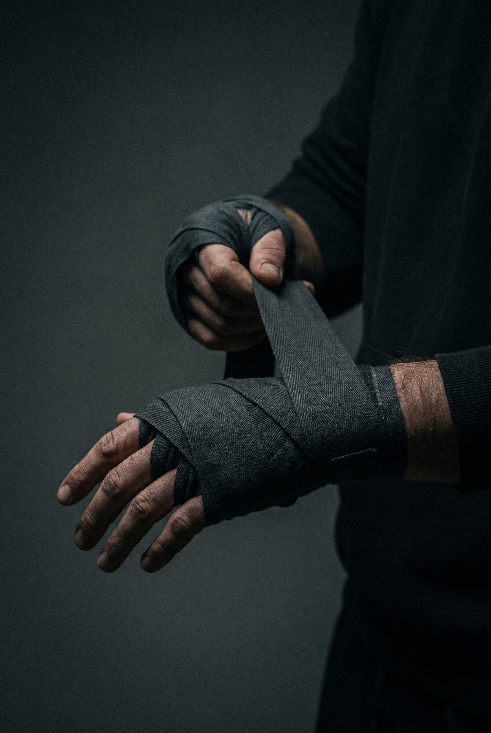 A fighter wrapping their hands